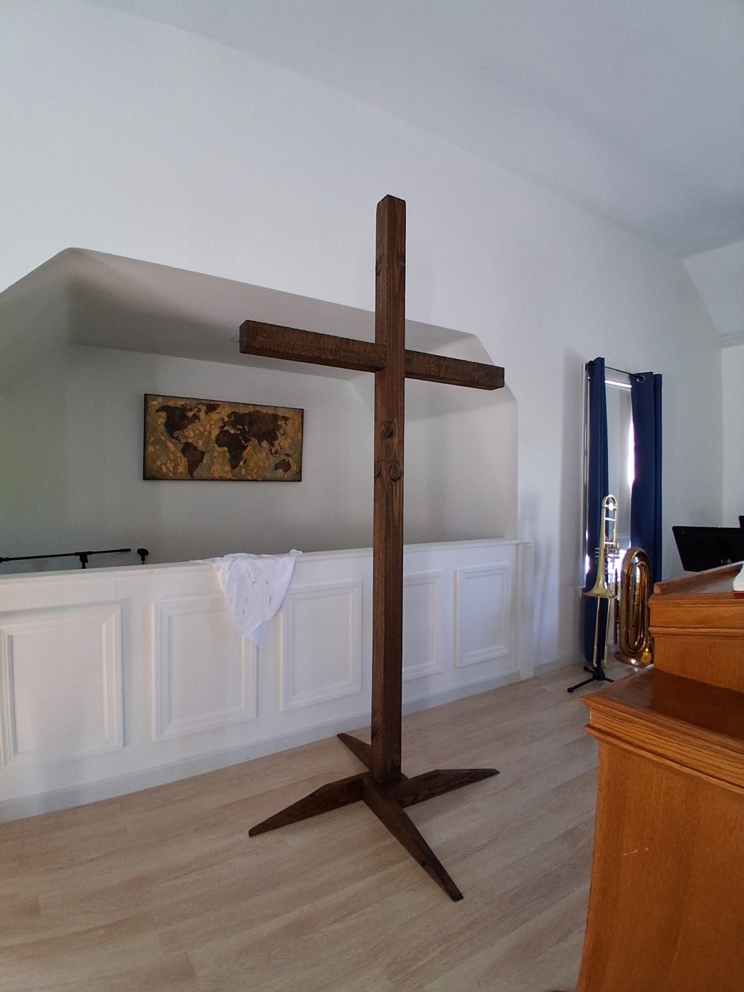 Large handmade wooden cross in a church sanctuary